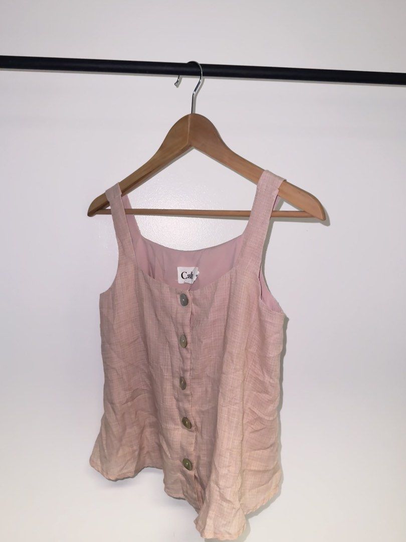 Calli Pink Top (Category: Sleeveless) located in Quezon City. Submitted by coolmomma (Listing ID 1469732214, Image 2). Description: Good condition Length 21 in. fits small to medium .