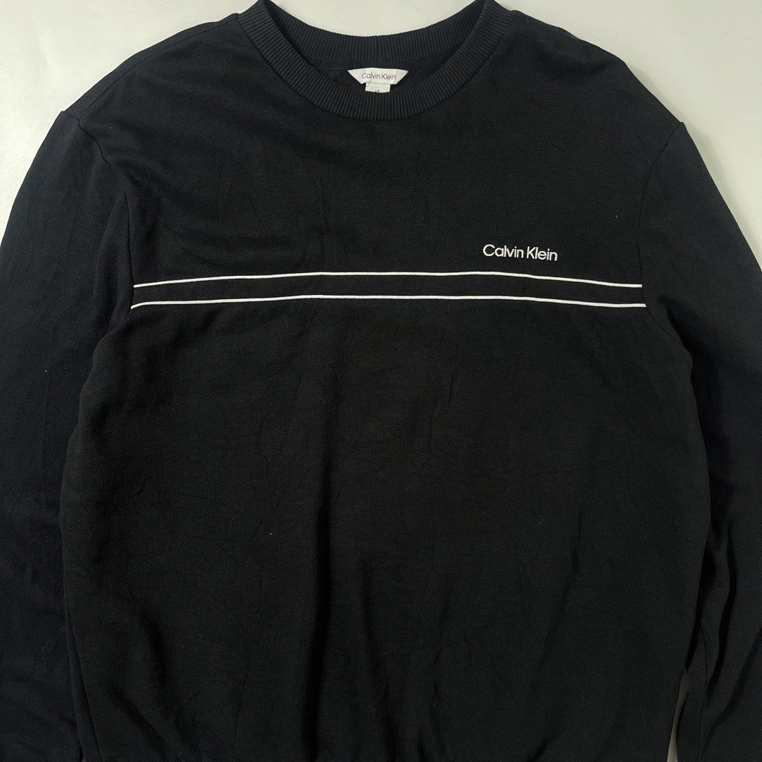 Calvin Klein Mesh Black Sweater Embroid design (Category: Coats, Jackets and Outerwear) located in Nasugbu. Submitted by janstuffs.ph (Listing ID 1469744455, Image 3). Description: CK Mesh Sweater Super comfy 💯Legit! Size: Large on tag - Best fit XL Width: 25" Length: 29" Sleeve: 25" Condition: 10/10 Like New! Flaw: NONE Mine: 980.