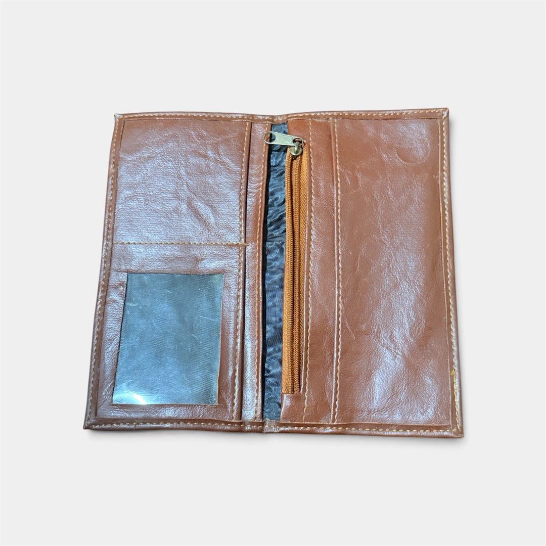 Calvin Paris Brown Long Wallet (Category: Wallets & Card holders) located in Manila. Submitted by only_alyssacloset (Listing ID 1469647582, Image 2). Description: Brand: Calvin Paris Material: Brown leather with stylish contrast stitching.