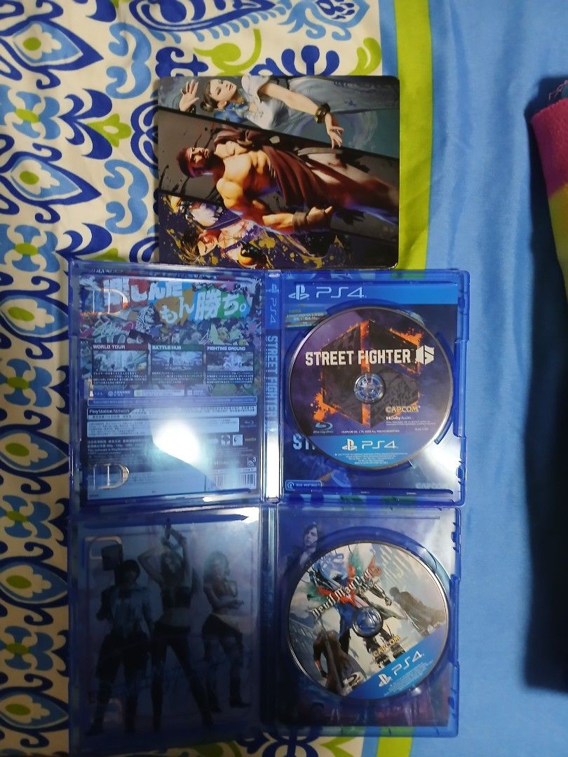 Capcom PlayStation 4 Games and Steelbook Bundle (Category: PlayStation) located in Paranaque City. Submitted by juntee.pabo (Listing ID 1469670941, Image 2). Description: - Platform: PlayStation 4 (PS4) - Games included: Street Fighter 6 & Devil May Cry 5 - Special inclusion: Official Street Fighter 6 steelbook case alongside standard cases - Condition: Clean discs and cases, well-maintained - Ideal for: Capcom fighting and action game enthusiast