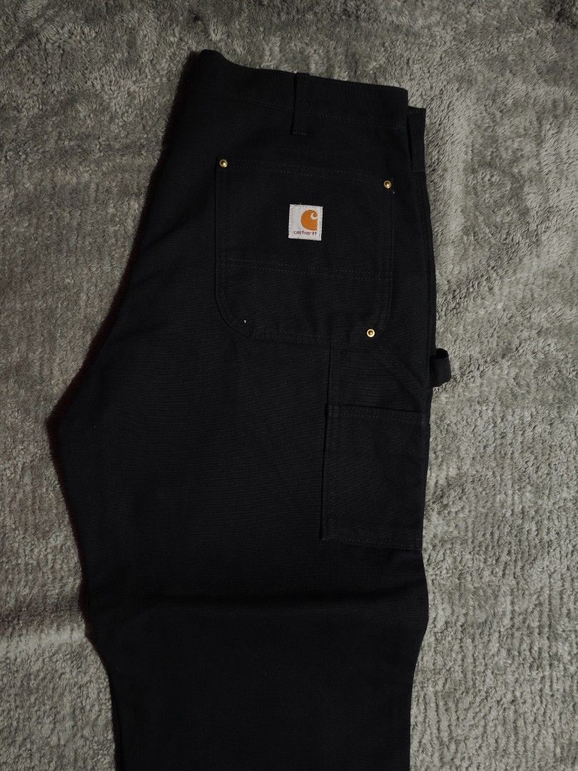 CARHARTT DOUBLE KNEE (Category: Jeans) located in Dalaguete. Submitted by three7archives (Listing ID 1469699159, Image 3). Description: - Brand/Model: Carhartt Double Knee work pants - Color: Classic Black - AS NEW - Size: US 36 / EU 46 / UK 36 (XL) - Material: Heavy-duty durable canvas - Features: Double knee reinforcement, gold-tone metal rivets, utility pockets, and hammer loop - Condition: Excellent, well-maintained.