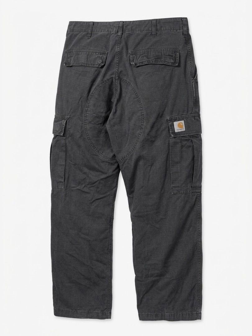 Carhartt WIP Regular Cargo Pant Dark Grey (Category: Jeans) located in Manila. Submitted by fiercehorse-60ca (Listing ID 1469598782, Image 2). Description: - Brand: Carhartt WIP - Style: Regular Cargo Pants - Color: Dark Grey - Material: Durable Ripstop Fabric - Size: 33 x 32 - Origin: Made in Tunisia - Features: Multiple utility pockets, reinforced knee panels, rear seat patch, and button fly closure - Branding: Iconic woven square Carhartt logo