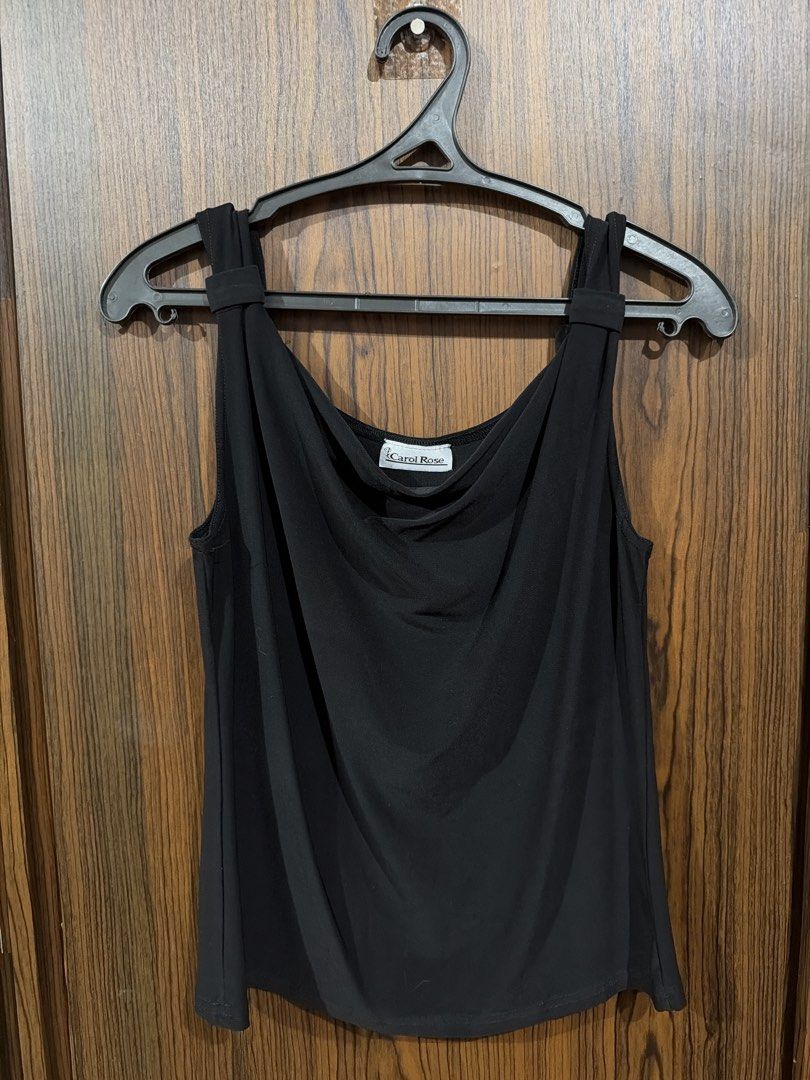 Carol Rose Black Cowl Neck Tank Top (Category: Sleeveless) located in Quezon City. Submitted by co.coph (Listing ID 1469701009, Image 1). Description: - Brand: Carol Rose - Color: Classic Black - Neckline: Elegant draped cowl neck - Straps: Thick straps with stylish loop detail - Fabric: Smooth, stretchy material that drapes beautifully - Style: Versatile piece, perfect for layering or wearing solo - Condition: Clean, smoke-free home.
