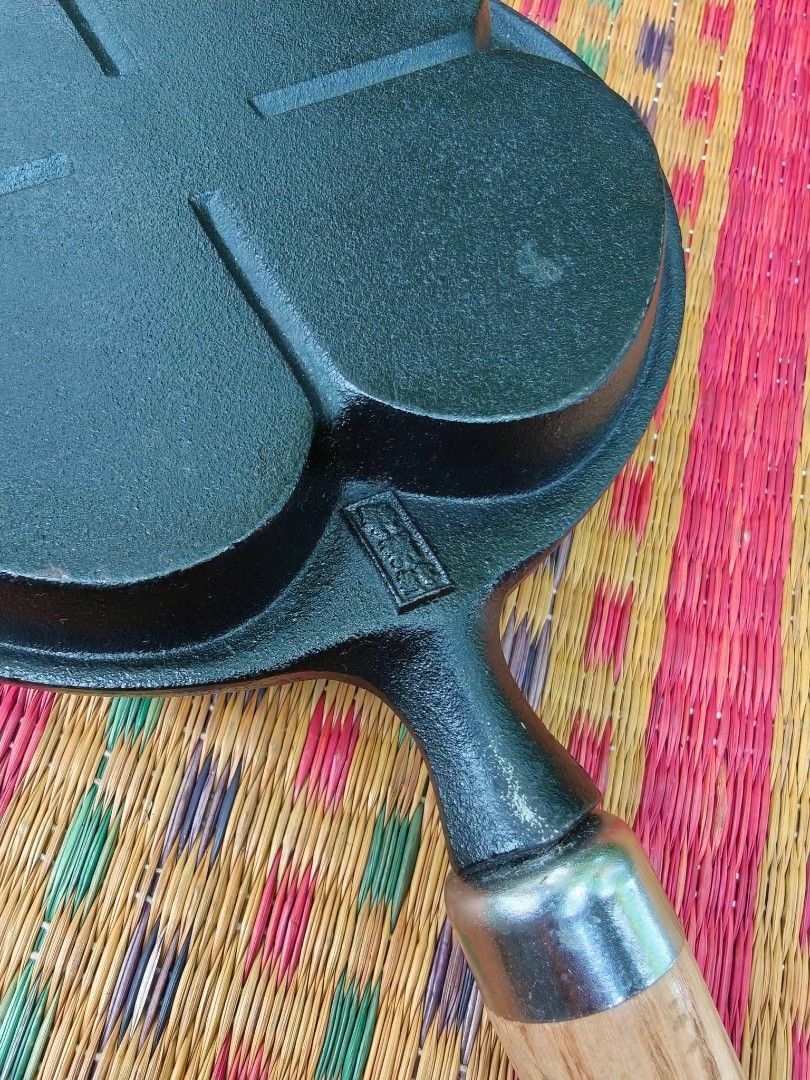 Cast Iron Egg & Pancake Pan with Wood Handle (Category: Cookware & Accessories) located in Cainta. Submitted by ewokee (Listing ID 1469730403, Image 3). Description: - Made in Japan 4-in-1 Design: Features four separate sections, ideal for cooking mini pancakes, eggs, or burger patties simultaneously. - Heavy-Duty Cast Iron: Ensures superior and even heat distribution for perfectly cooked meals. - Removable Wooden Handle: Screws on and off easily