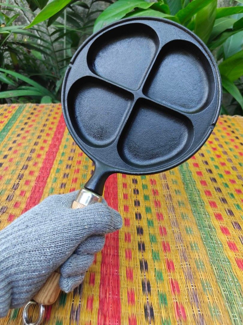 Cast Iron Egg & Pancake Pan with Wood Handle (Category: Cookware & Accessories) located in Cainta. Submitted by ewokee (Listing ID 1469730403, Image 1). Description: - Made in Japan 4-in-1 Design: Features four separate sections, ideal for cooking mini pancakes, eggs, or burger patties simultaneously. - Heavy-Duty Cast Iron: Ensures superior and even heat distribution for perfectly cooked meals. - Removable Wooden Handle: Screws on and off easily