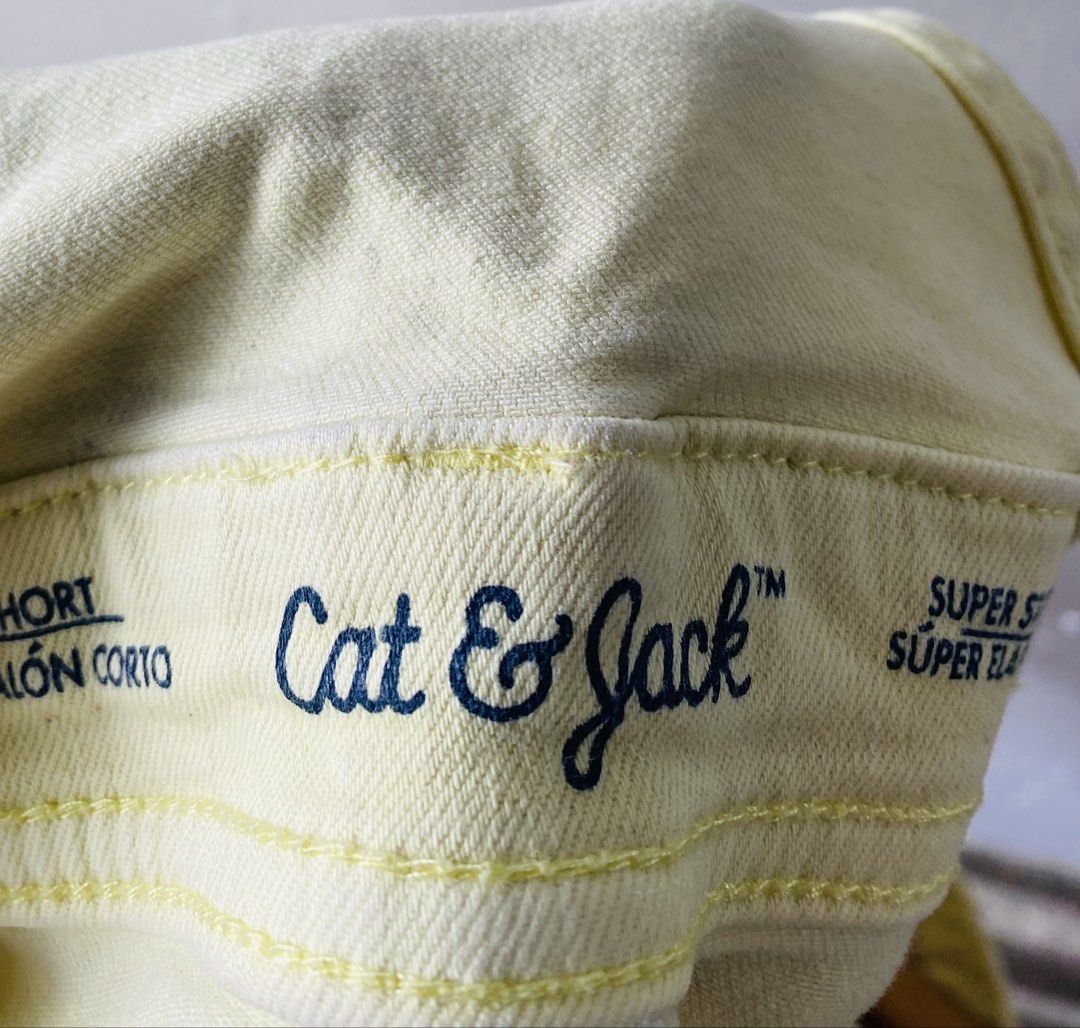 Cat & Jack Yellow Denim Overalls Shorts (Category: Rompers) located in Caloocan City. Submitted by lovemyclothes21 (Listing ID 1469612010, Image 2). Description: - Brand/Model: Cat & Jack denim overall shorts - Size: 28 Medium - Color: Bright yellow - Material: Super stretch fabric for comfort - Design: Frayed raw hem with multiple front bib and side pockets - Hardware: Metal buttons on straps and waist.