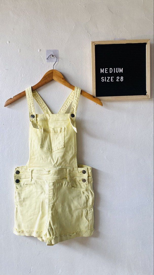 Cat & Jack Yellow Denim Overalls Shorts (Category: Rompers) located in Caloocan City. Submitted by lovemyclothes21 (Listing ID 1469612010, Image 1). Description: - Brand/Model: Cat & Jack denim overall shorts - Size: 28 Medium - Color: Bright yellow - Material: Super stretch fabric for comfort - Design: Frayed raw hem with multiple front bib and side pockets - Hardware: Metal buttons on straps and waist.