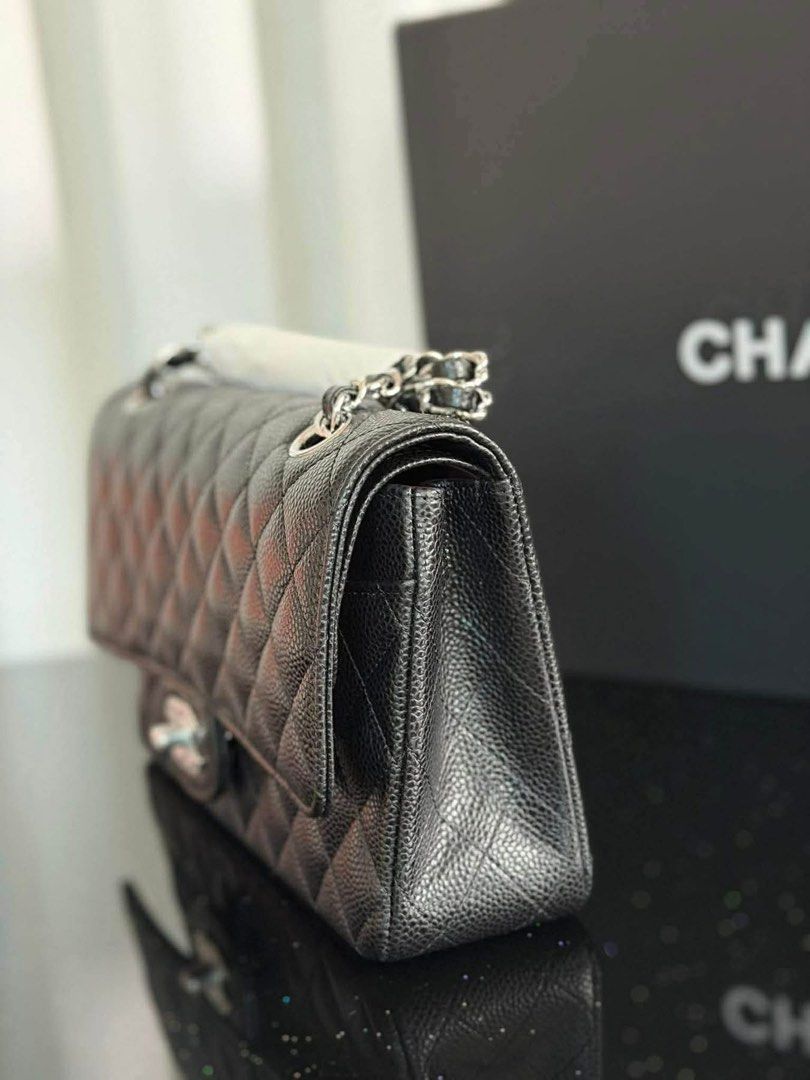 CC Classic Flap Bag Black Caviar Leather Silver Hardware (Category: Luxury Bags & Wallets) located in Manila. Submitted by bagsandmanymanymore1 (Listing ID 1458590030, Image 3). Description: - Classic CC flap bag -Size 25cm - Black caviar leather -What you see is what you get - Silver hardware - Iconic quilted design - Deep burgundy interior - Comes with original box Please read before you order 👉🏻❗️Payment first before shipping ❗️Cut off time 