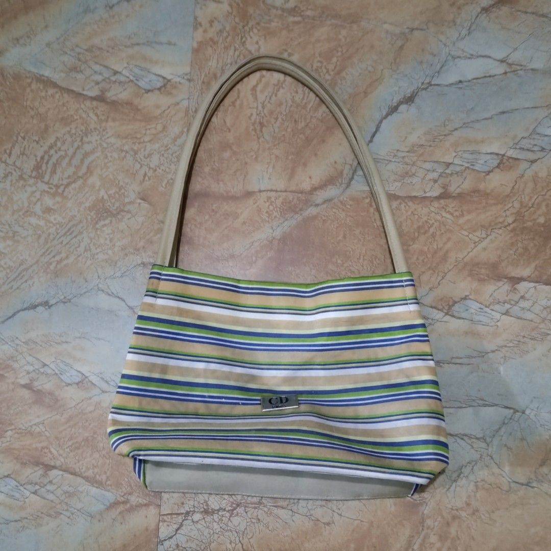CD Striped Shoulder Bag Shoulder Baguette (Category: Shoulder Bags) located in Valenzuela. Submitted by 0003c4 (Listing ID 1469750534, Image 2). Description: features a small CD logo plaque on the front needs wash!! location: Valenzuela or Malabon mod: lalamove or jnt.