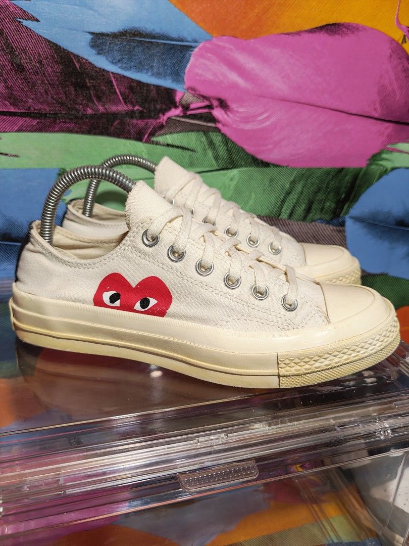 CDG PLAY x Converse Chuck 70 Low White (Category: Sneakers) located in Dulag. Submitted by konswelosesilyamariya18 (Listing ID 1469608885, Image 2). Description: - Brand: Comme des Garcons PLAY x Converse - Style: Low top canvas sneakers - Color: Off-white with iconic red heart logo and contrast black heel strip - Sole: Vulcanized rubber midsole with minor, natural yellowing - Size: US Men's 6 / US Women's 8 / EUR 39 - Condition: Includes origina