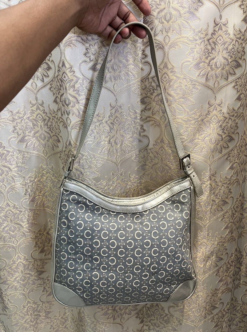 Celine C Monogram Silver Leather Canvas Shoulder Bag (Category: Luxury Bags & Wallets) located in General Santos City (Dadiangas). Submitted by thiftnibadi3 (Listing ID 1469665003, Image 2). Description: - Authentic grey canvas shoulder bag with classic all-over C monogram pattern - Eye-catching silver metallic leather trim and piping details - Secure top zipper closure to keep your essentials safe - Adjustable shoulder strap with stylish buckle 