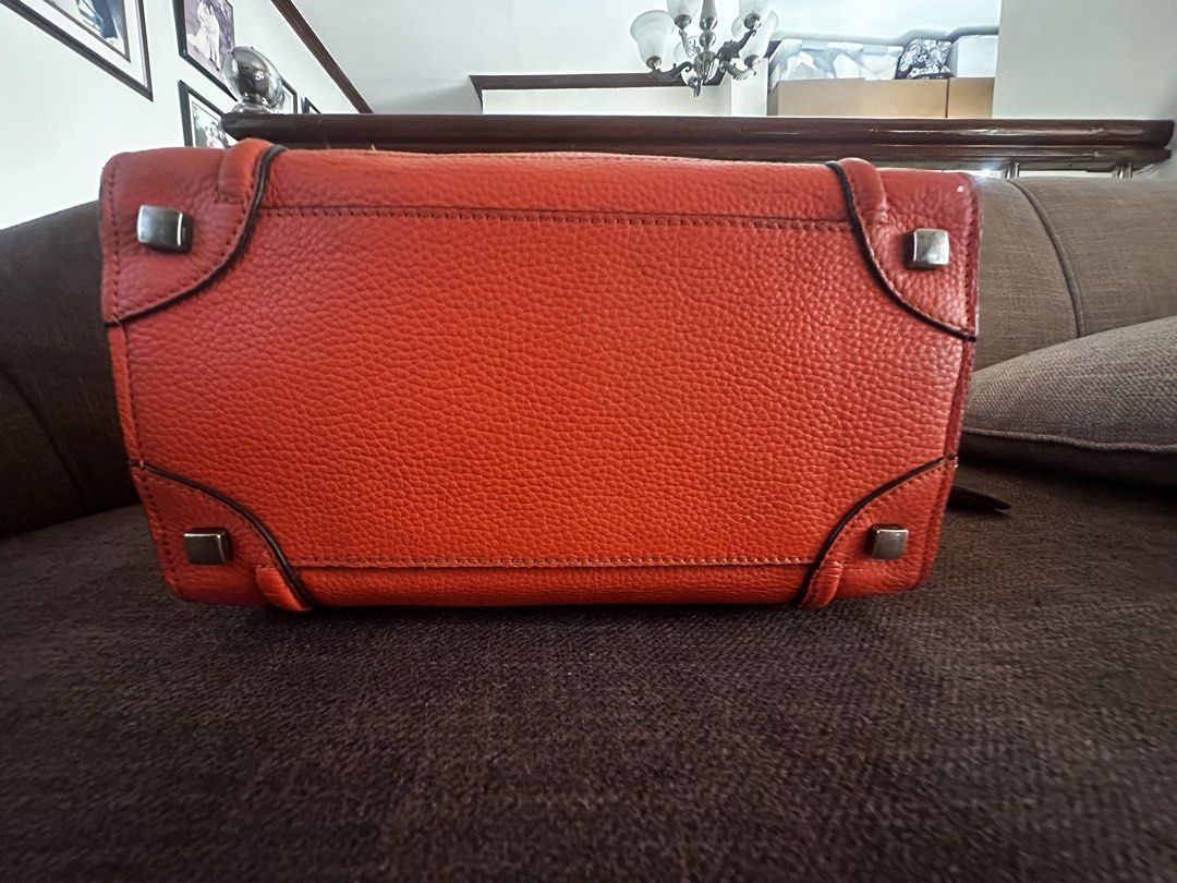 CELINE MICRO LUGGAGE in Vermillion Orange (Category: Tote Bags) located in Dasmarinas. Submitted by vintagevoom (Listing ID 1469644204, Image 3). Description: Celine Micro Luggage in Vermillion Orange NEGOTIABLE Thrifted - NGA (Kindly self authenticate) Minor signs of usage Coded Intact rubber lining Dimensions: L - 10 inches H - 10 inches W - 6 inches.
