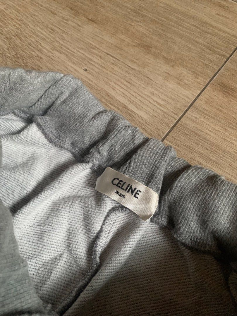 Celine Paris Grey Sweat Shorts Size M (Category: Shorts) located in Tarlac. Submitted by luxurious_apparel (Listing ID 1469658665, Image 3). Description: - Brand: Celine Paris - Size: M (tags attached) -Unisex - Color: Grey with cream drawstrings and metal aglets - Details: Small white embroidered Celine logo on left leg, trendy raw edge hem - Interior: Soft and cozy fleece lining - Condition: Brand new with back tags intact.
