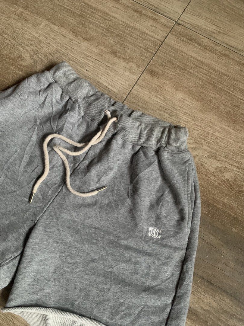 Celine Paris Grey Sweat Shorts Size M (Category: Shorts) located in Tarlac. Submitted by luxurious_apparel (Listing ID 1469658665, Image 2). Description: - Brand: Celine Paris - Size: M (tags attached) -Unisex - Color: Grey with cream drawstrings and metal aglets - Details: Small white embroidered Celine logo on left leg, trendy raw edge hem - Interior: Soft and cozy fleece lining - Condition: Brand new with back tags intact.