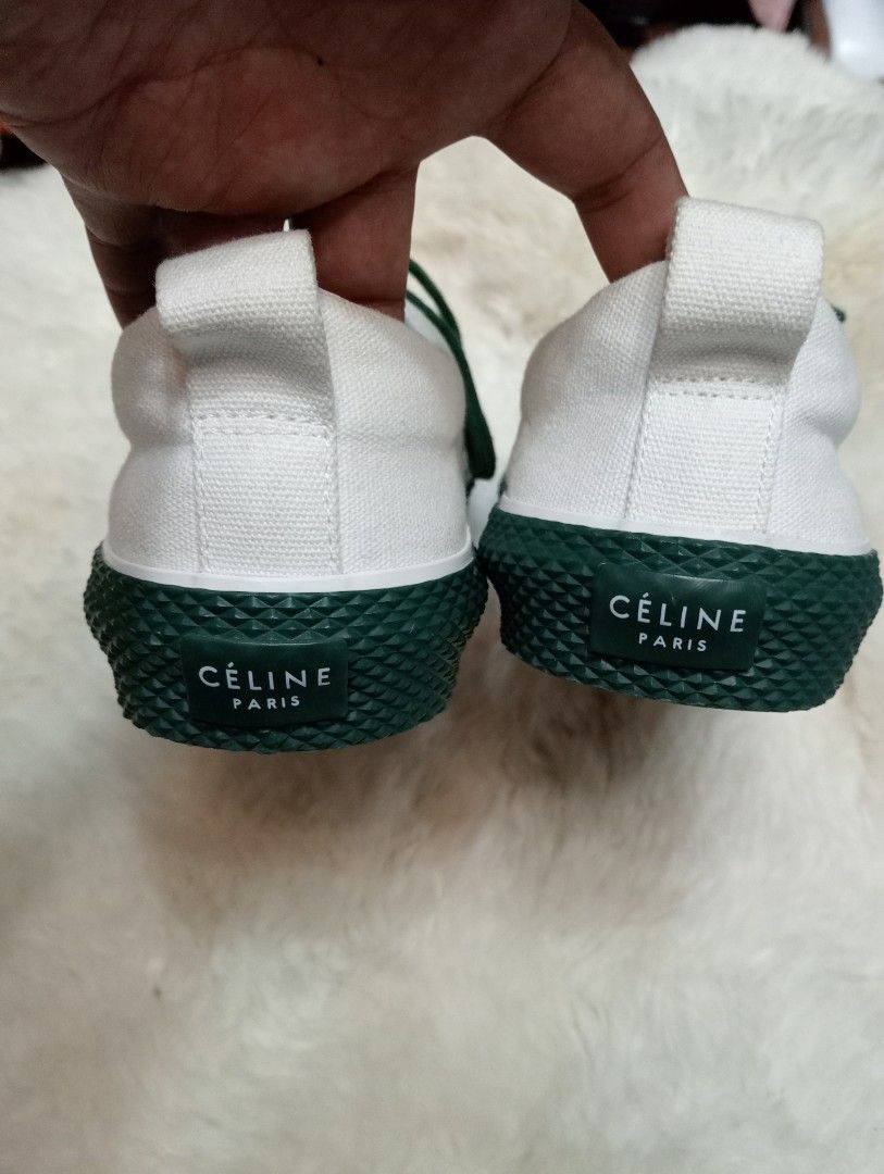 Celine White Canvas Sneakers with Green Sole (Category: Sneakers) located in Cabadbaran. Submitted by lioness_cave (Listing ID 1469700470, Image 3). Description: - Brand: Celine - Style: Low top sneakers - Color: White canvas with dark green laces and accents - Details: Green heel bumper with Celine Paris branding, branded insole, and heel pull tab - Condition: Fresh pair with clean soles, sturdy build, and ready to wear.