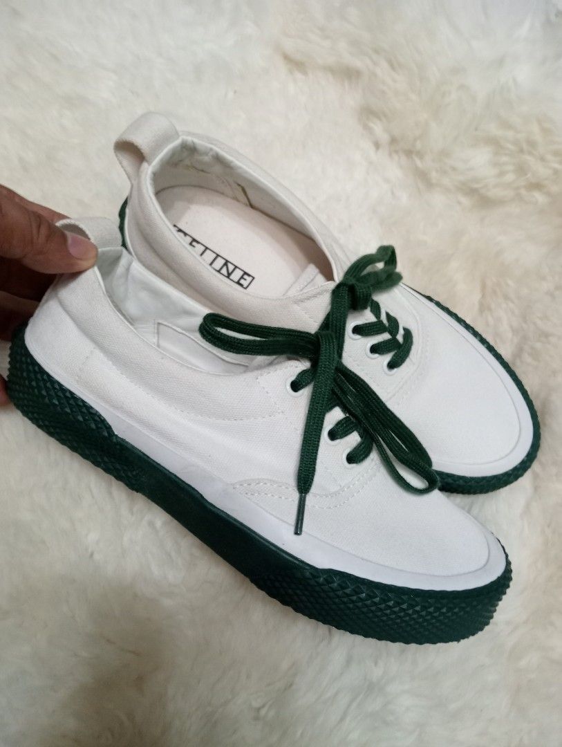 Celine White Canvas Sneakers with Green Sole (Category: Sneakers) located in Cabadbaran. Submitted by lioness_cave (Listing ID 1469700470, Image 1). Description: - Brand: Celine - Style: Low top sneakers - Color: White canvas with dark green laces and accents - Details: Green heel bumper with Celine Paris branding, branded insole, and heel pull tab - Condition: Fresh pair with clean soles, sturdy build, and ready to wear.