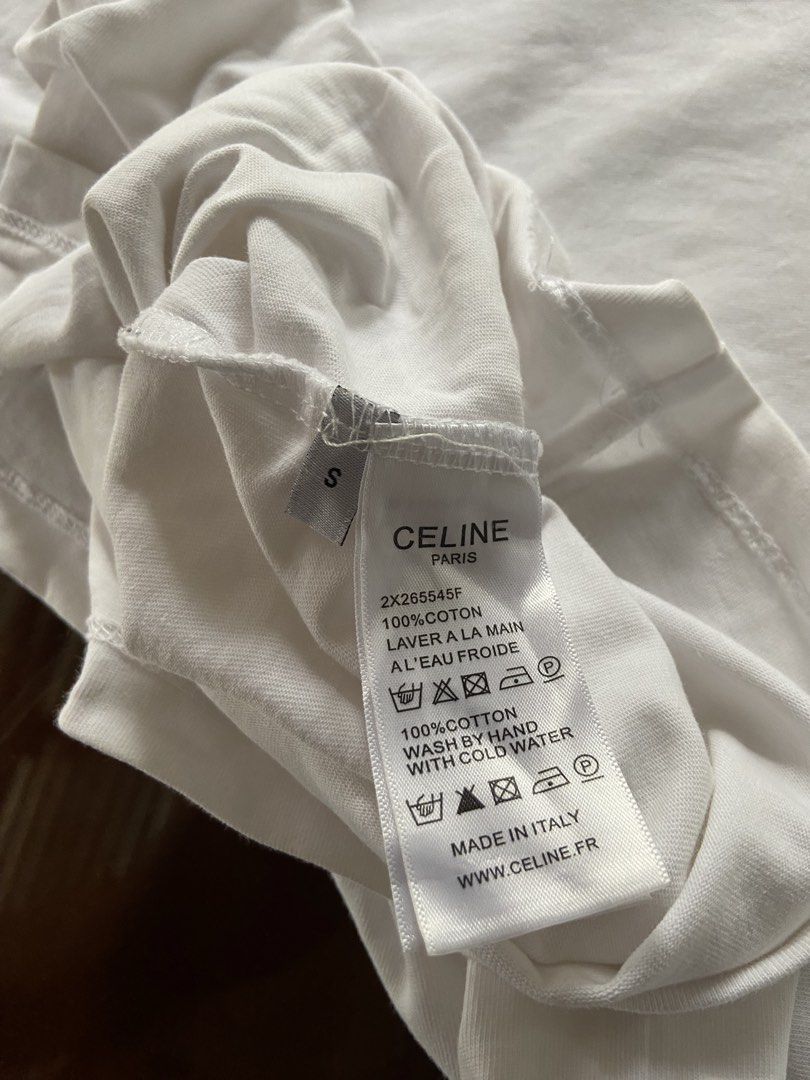 Celine White Tee (Category: Luxury Apparel) located in Panabo. Submitted by thrifty.red (Listing ID 1469625611, Image 3). Description: width:18 length:26 small to medium Excellent no issue washable stain only.