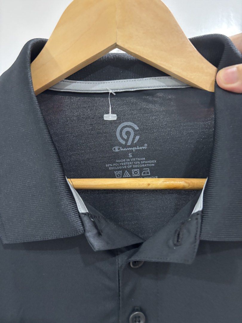 Champion C9 Black Polo Shirt (Category: Tshirts & Polo Shirts ) located in Calbayog City. Submitted by zaxcheus_castillo1708 (Listing ID 1469672195, Image 2). Description: - Brand: C9 Champion - Color: Black - Size: Small - Material: 88% polyester, 12% spandex blend (lightweight & stretchy) - Style: Short sleeve with button placket - Ideal for: Casual wear, workouts, and sports.