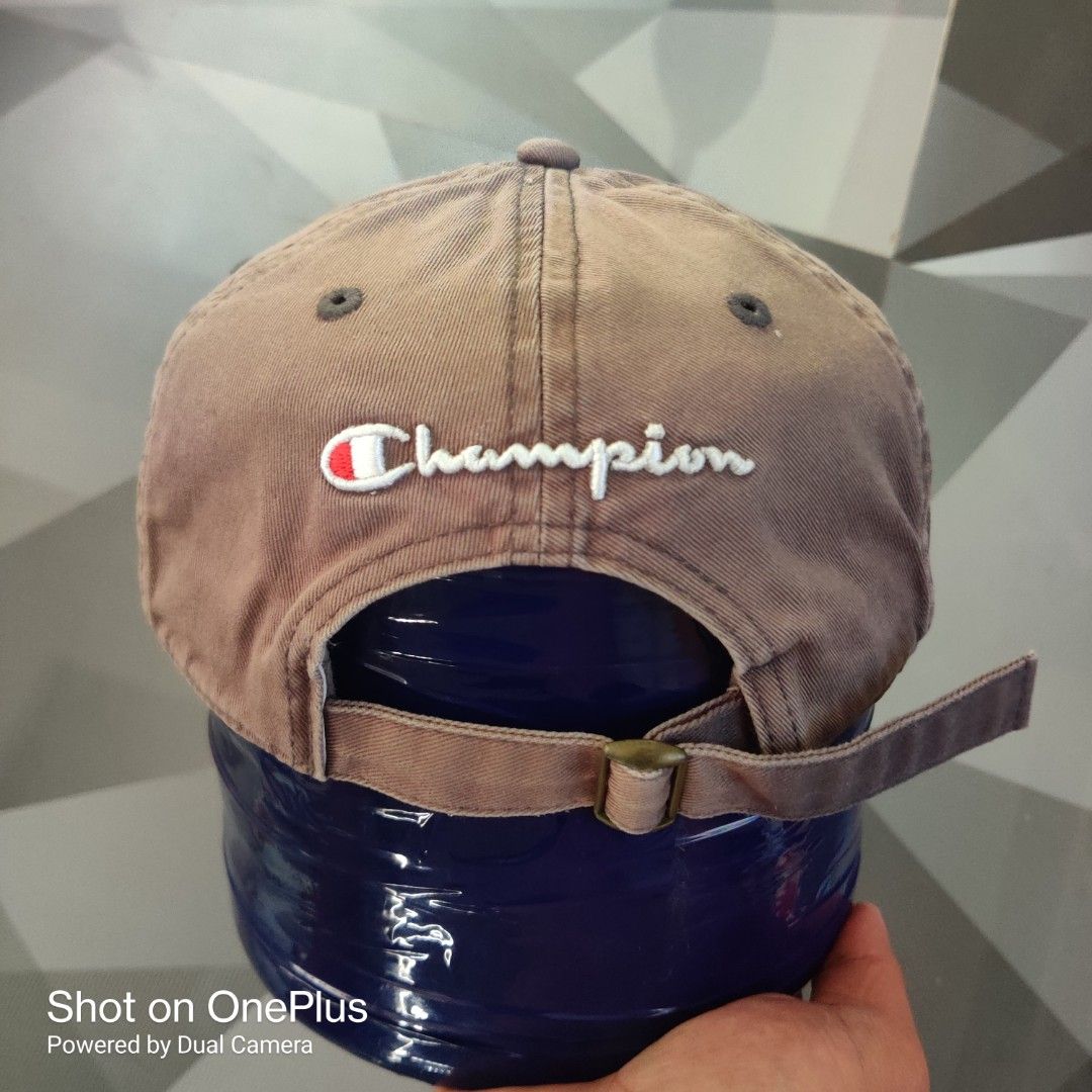 Champion classic twill dad hat (Category: Caps & Hats) located in Baguio. Submitted by ferns_garage.0924 (Listing ID 1469627082, Image 3). Description: Champion classic twill dad hat. It features a six-panel dad fit construction with unstructured canvas 100% cotton, matching embroidered ventilation eyelets, and the classic embroidered Champion "C" patch logo centered on the front dome. color faded cement grey sign of use(not brand new) scan pics 