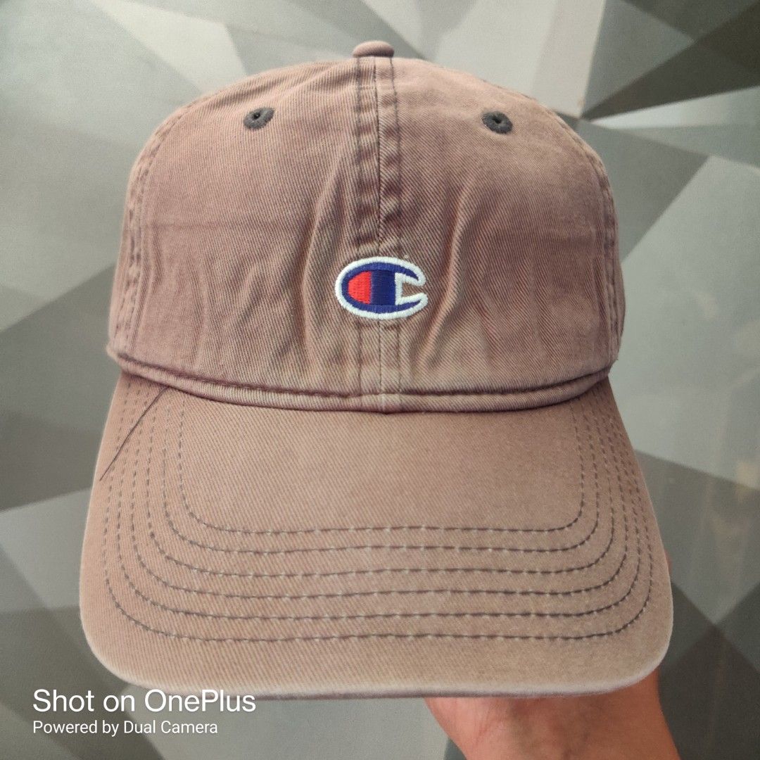 Champion classic twill dad hat (Category: Caps & Hats) located in Baguio. Submitted by ferns_garage.0924 (Listing ID 1469627082, Image 1). Description: Champion classic twill dad hat. It features a six-panel dad fit construction with unstructured canvas 100% cotton, matching embroidered ventilation eyelets, and the classic embroidered Champion "C" patch logo centered on the front dome. color faded cement grey sign of use(not brand new) scan pics 
