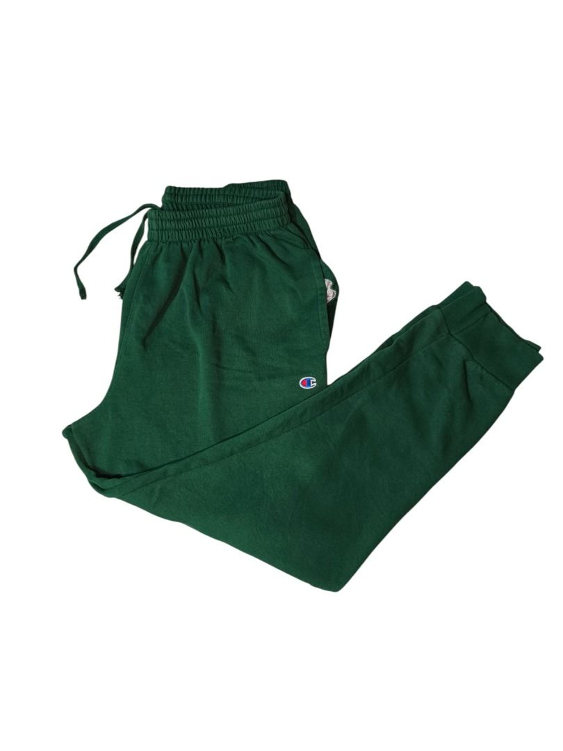 Champion Dark Green Logo Sweatpants (Category: Activewear) located in Baguio. Submitted by boneteezandharmony (Listing ID 1469663112, Image 1). Description: Classic dark green Champion sweatpants featuring the signature embroidered C logo, elastic waistband with drawstring, side pockets, and ribbed ankle cuffs. Made in Pakistan. Condition: 9/10 Size on tag: 2XL Dimes: 18 × 44.