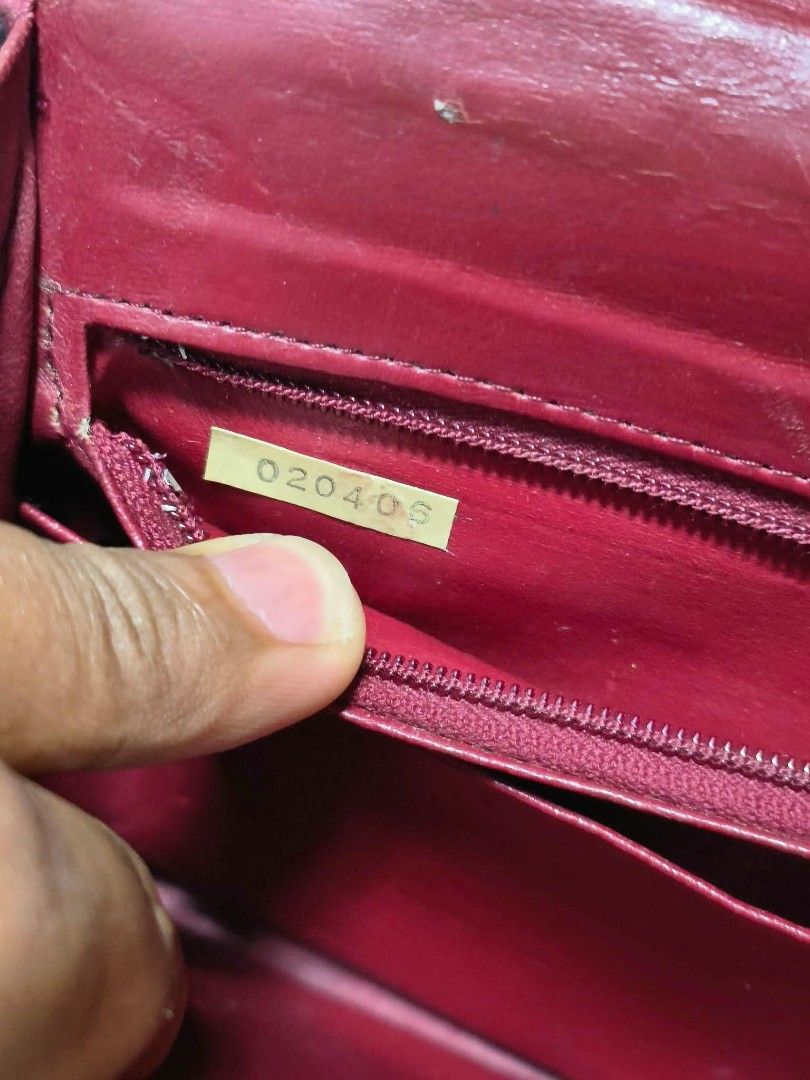 Chanel Quilted Black Leather Handbag (Category: Luxury Bags & Wallets) located in Davao. Submitted by navil01 (Listing ID 1469666181, Image 3). Description: - Brand: Chanel - Material: Black quilted leather with burgundy leather lining - Hardware: Gold-tone (features noticeable fading and scuffs) - Closure: Classic front flap with turn-lock - Strap: Gold chain strap - Interior: Zip pocket and slip compartments - Origin: Made in France (with store