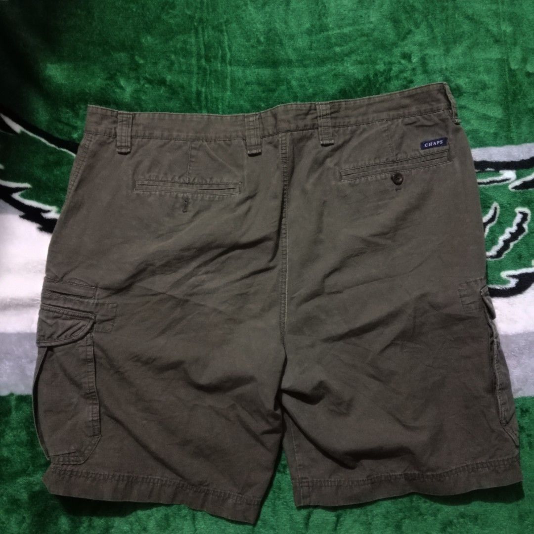 Chaps Cargo Shorts Olive Green Size 42 (Category: Shorts) located in Silang. Submitted by densrodrig08604 (Listing ID 1469738893, Image 1). Description: - Brand/Model: Chaps Cargo Shorts - Color: Olive Green - Size: 42 waist - Length: 20 inches - Material: 100% Cotton (Made in Vietnam) - Features: Multiple side and back pockets, classic button closure with zipper fly - Condition: Excellent, clean fabric with no stains or rips - Style: Great for e