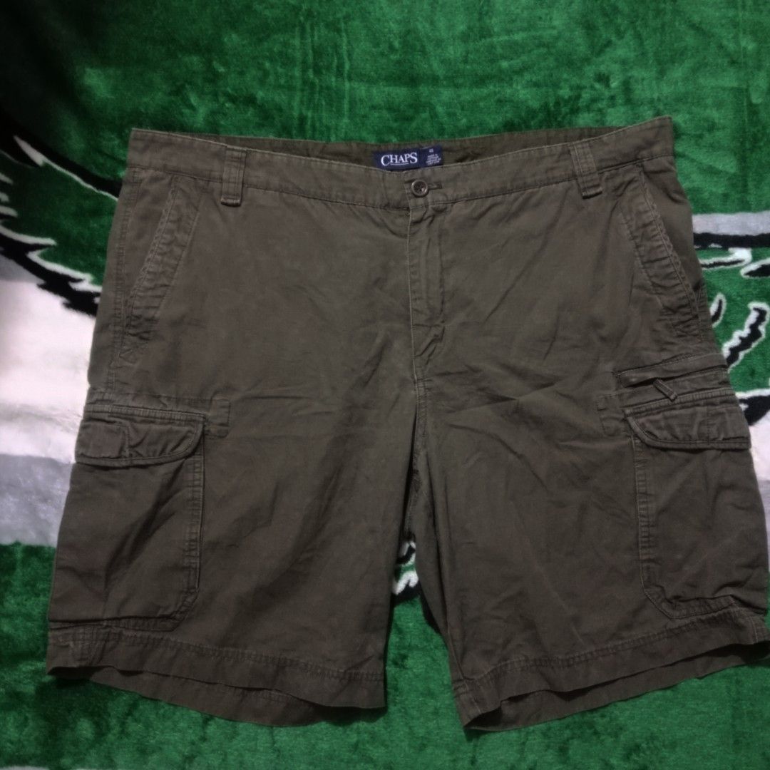 Chaps Cargo Shorts Olive Green Size 42 (Category: Shorts) located in Silang. Submitted by densrodrig08604 (Listing ID 1469738893, Image 3). Description: - Brand/Model: Chaps Cargo Shorts - Color: Olive Green - Size: 42 waist - Length: 20 inches - Material: 100% Cotton (Made in Vietnam) - Features: Multiple side and back pockets, classic button closure with zipper fly - Condition: Excellent, clean fabric with no stains or rips - Style: Great for e
