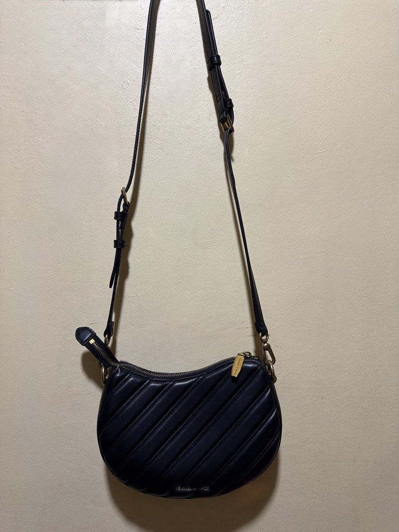Charles & Keith (Category: Luxury Bags & Wallets) located in Taguig. Submitted by pepperonia_01 (Listing ID 1469588288, Image 3). Description: Charles & Keith Freja Curved Panelled Bag Like new Product Details -curved silhouette and panelled exterior. -Swinging from a bag strap with gold-tone chunky chain-links -Material: Faux leather.
