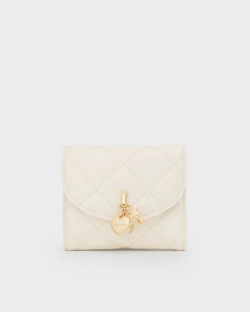 Charles & Keith Arrietty Curved Flap Wallet (Category: Wallets & Card holders) located in Pasig City. Submitted by ff.ph (Listing ID 1469748684, Image 3). Description: Bifold Wallet With Box and Tag Available in 3 colors Burgundy - Black - Cream With Small paperbag .