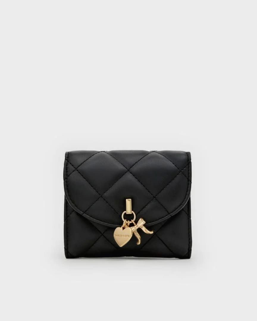 Charles & Keith Arrietty Curved Flap Wallet (Category: Wallets & Card holders) located in Pasig City. Submitted by ff.ph (Listing ID 1469748684, Image 2). Description: Bifold Wallet With Box and Tag Available in 3 colors Burgundy - Black - Cream With Small paperbag .
