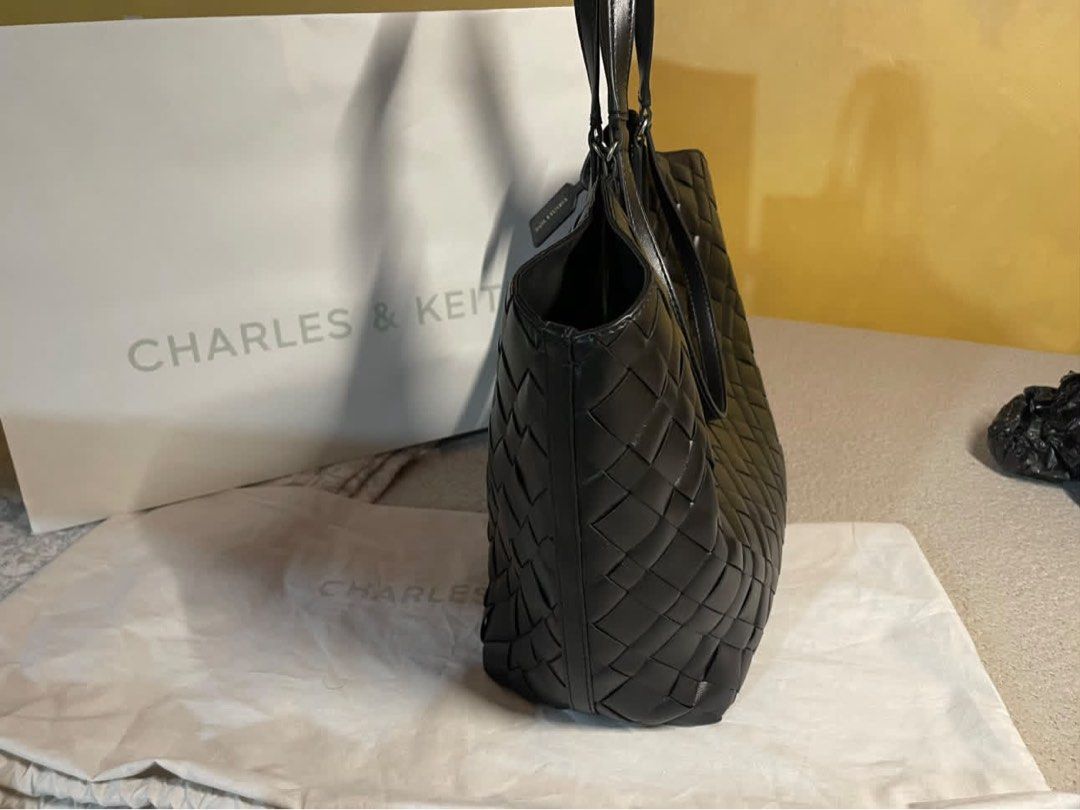 Charles & Keith Black IVETTE Tote Bag (Category: Tote Bags) located in Manila. Submitted by baobao05 (Listing ID 1469617896, Image 3). Description: - Charles & Keith - Color: Black - Material: Stylish woven design with a clean, structured finish - Compartments: Spacious main interior with secure magnetic closure - Includes: Matching inner pouch for extra organization - Straps: Comfortable dual shoulder straps - Extras: Original dust bag and paper