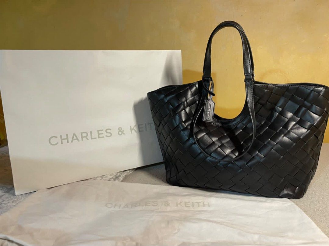 Charles & Keith Black IVETTE Tote Bag (Category: Tote Bags) located in Manila. Submitted by baobao05 (Listing ID 1469617896, Image 2). Description: - Charles & Keith - Color: Black - Material: Stylish woven design with a clean, structured finish - Compartments: Spacious main interior with secure magnetic closure - Includes: Matching inner pouch for extra organization - Straps: Comfortable dual shoulder straps - Extras: Original dust bag and paper