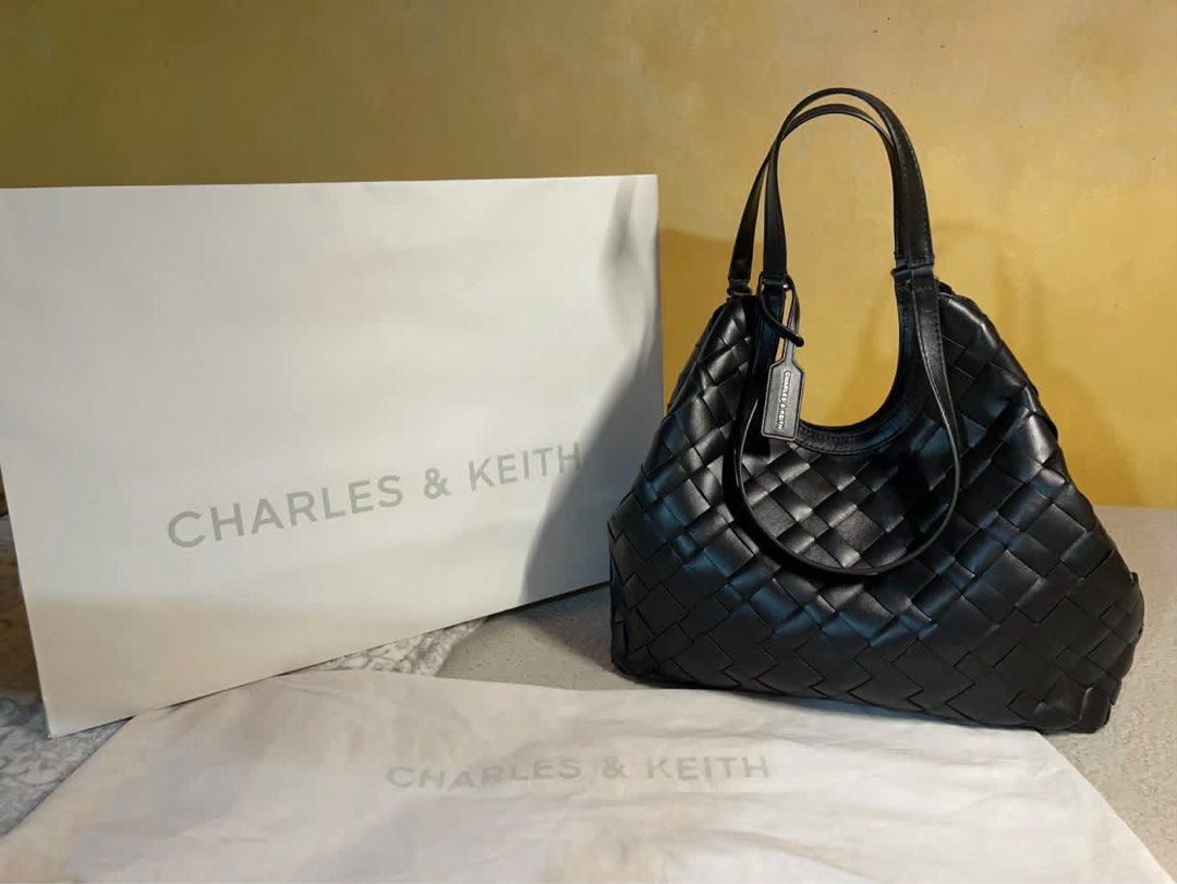Charles & Keith Black IVETTE Tote Bag (Category: Tote Bags) located in Manila. Submitted by baobao05 (Listing ID 1469617896, Image 1). Description: - Charles & Keith - Color: Black - Material: Stylish woven design with a clean, structured finish - Compartments: Spacious main interior with secure magnetic closure - Includes: Matching inner pouch for extra organization - Straps: Comfortable dual shoulder straps - Extras: Original dust bag and paper