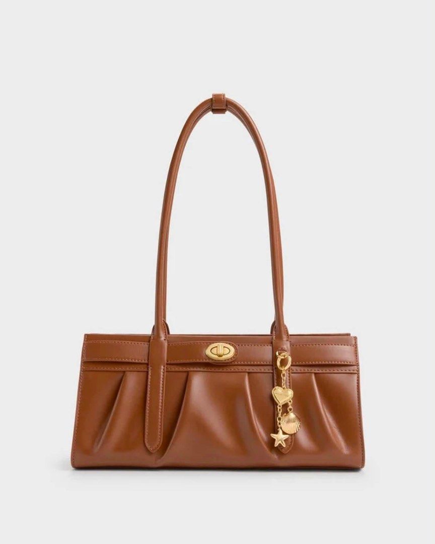 Charles & Keith Isolde Belted Ruched Shoulder Bag (Category: Shoulder Bags) located in Pasig City. Submitted by ff.ph (Listing ID 1469752698, Image 2). Description: Shoulder Bag Available in 3 colors Black - Cream - Chocolate Zipper closure Size 10 inches With Echodustbag and tag Add paperbag plus 80 .