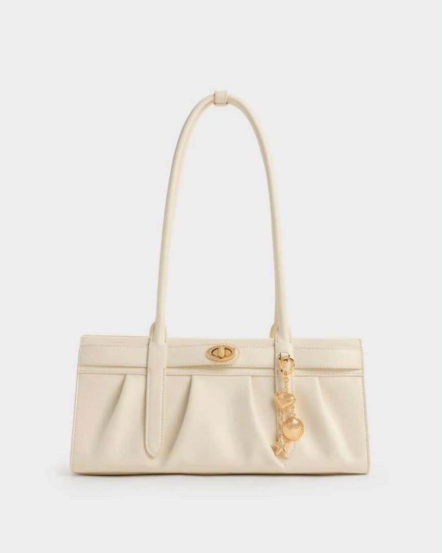 Charles & Keith Isolde Belted Ruched Shoulder Bag (Category: Shoulder Bags) located in Pasig City. Submitted by ff.ph (Listing ID 1469752698, Image 3). Description: Shoulder Bag Available in 3 colors Black - Cream - Chocolate Zipper closure Size 10 inches With Echodustbag and tag Add paperbag plus 80 .