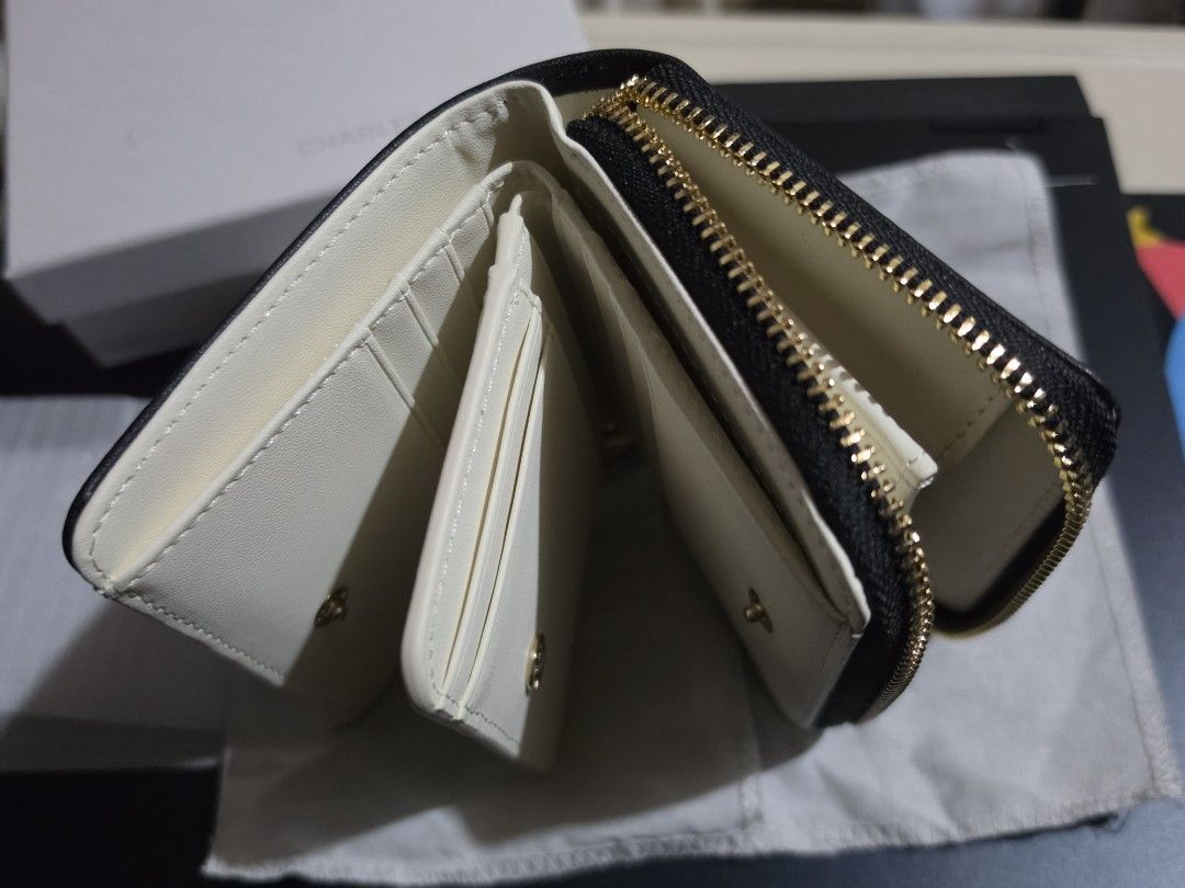 Charles & Keith wallet (black & white) (Category: Wallets & Card holders) located in Makati City. Submitted by randomelle (Listing ID 1469659300, Image 2). Description: Please read !!! For sale only, not rush Last price !!! RFS changed my mind, purchased something else Charles & Keith wallet Authentic NEW Excellent quality and condition✨️ Bought Oct 2026 with receipt! Packed in wallet cloth, box and paper bag. Photos are mine..