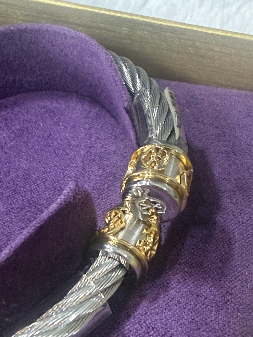 Charriol Char Logo Cable Bangle (Category: Bracelets) located in Las Pinas. Submitted by purse.vanity (Listing ID 1469674619, Image 2). Description: - Brand: Charriol - Model: Char Logo Cable Bangle - Color: Silver and gold tone - Size: small - Condition: Brand new, unworn, with protective plastic tubing intact - Inclusions: Original purple presentation box, pouch, and international warranty card dated September 2026 - 100% authentic and ready to