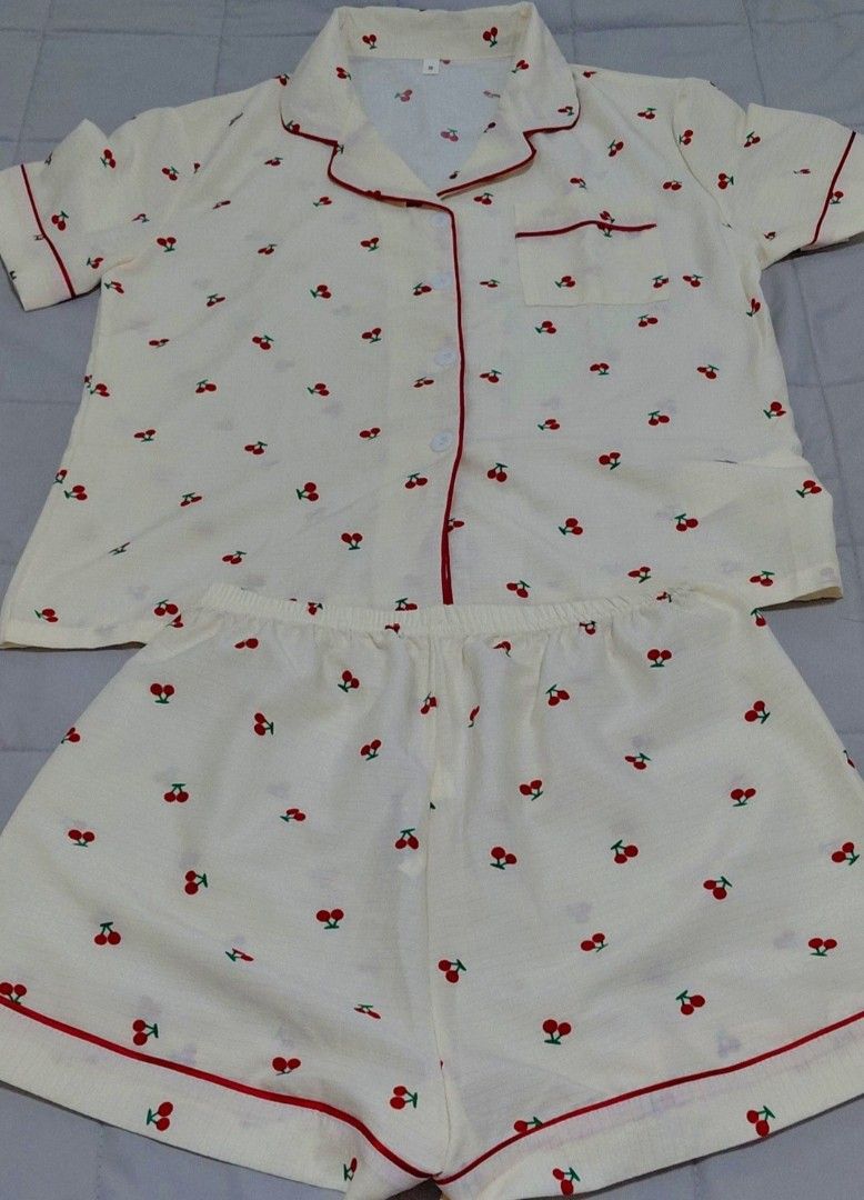Cherry Print Short Sleeve Pajama Set Size S (Category: Undergarments & Loungewear) located in Taguig. Submitted by ynelshop (Listing ID 1469690701, Image 1). Description: - Style: Cute cherry print pajama set in cream with red piping - Top: Short-sleeve, button-down with a convenient chest pocket - Bottoms: Matching shorts featuring a comfortable elastic waistband - Size: S - Material: Lightweight, soft, and breathable fabric ideal for sleeping o