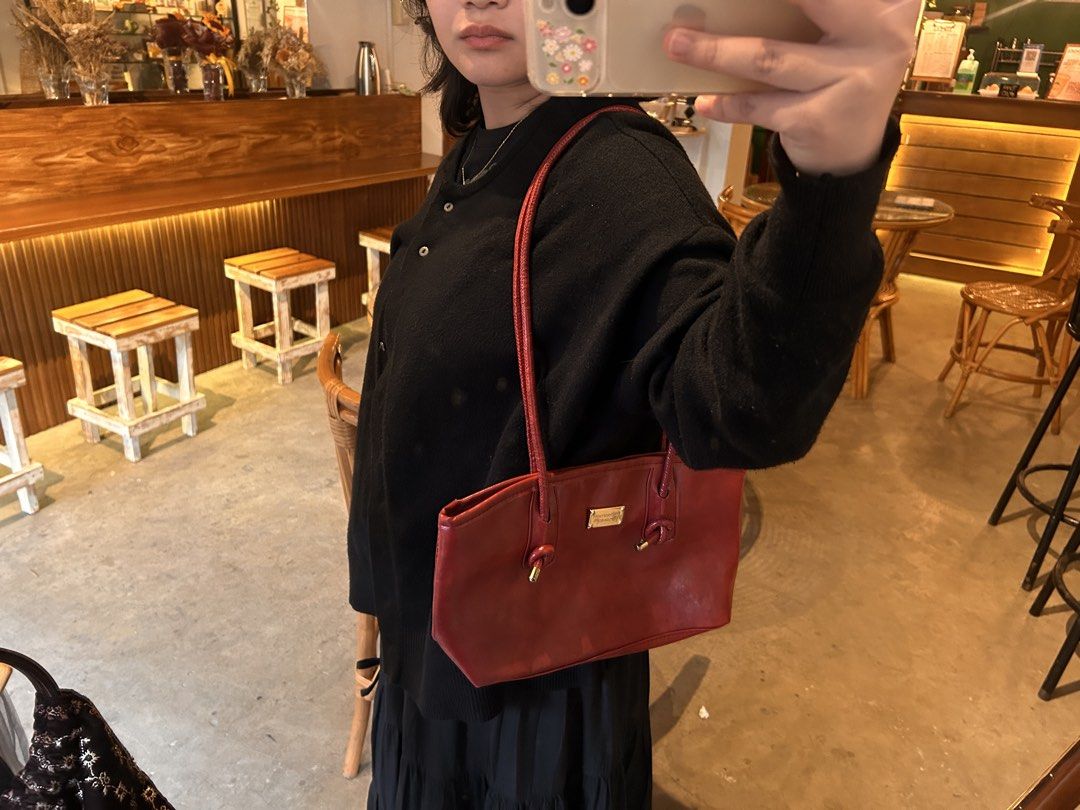 Chic red bag (Category: Shoulder Bags) located in Cagayan de Oro. Submitted by dreisellsnbuys (Listing ID 1469653292, Image 2). Description: Limited bag space, with zipper, long strap.
