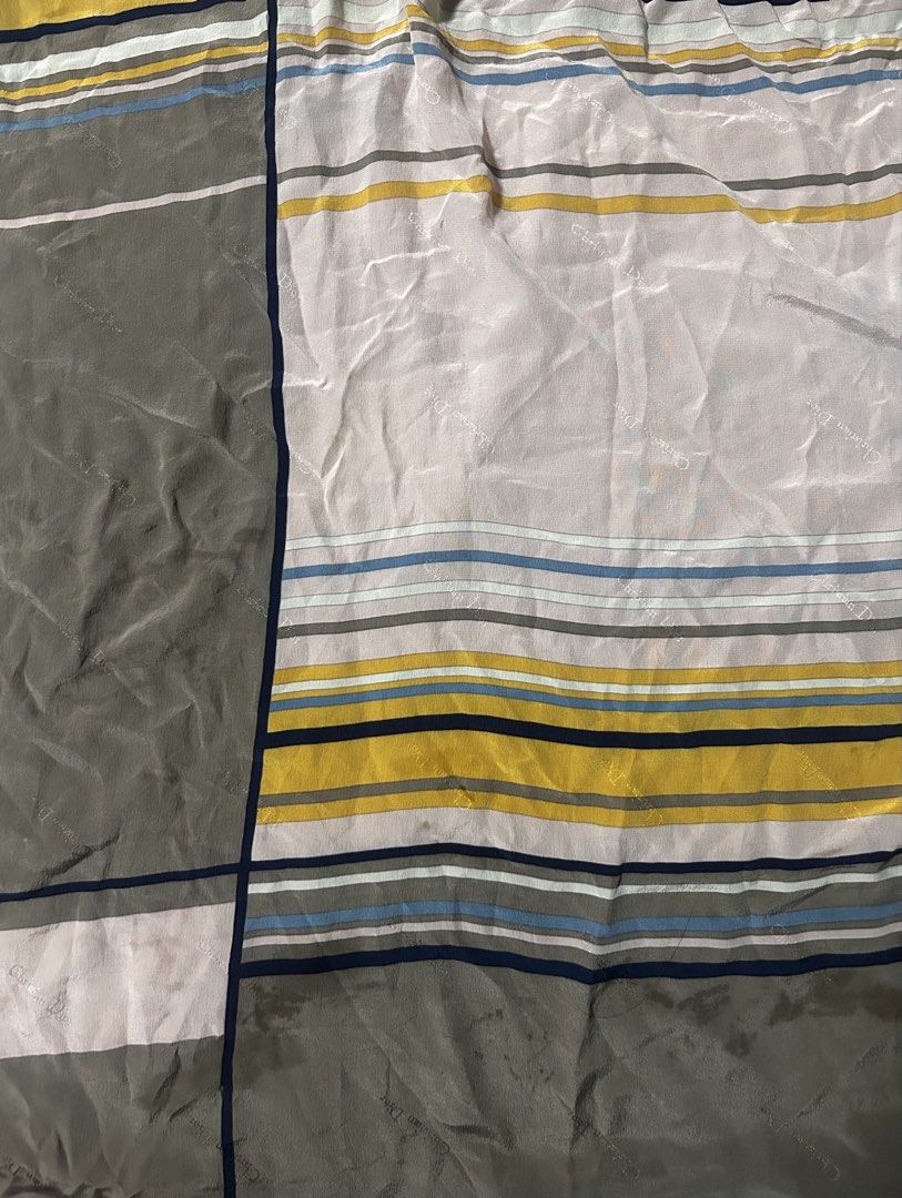 CHRISTIAN DIOR (Category: Scarves) located in Davao. Submitted by sart0ria85 (Listing ID 1469678557, Image 3). Description: - Authentic Christian Dior square silk scarf - Geometric color block design in mustard yellow, olive green, dusty pink, and blue with a navy blue border - Subtle monogram jacquard weave throughout the fabric - Versatile accessory for neck, bag, or hair styling EXCELLENT CONDITION (94/100).