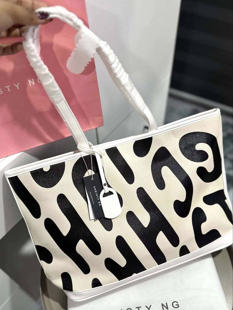 Christy Ng Logo Tote Bag (Category: Tote Bags) located in Bulacan. Submitted by mykakarizza (Listing ID 1469684659, Image 3). Description: STOCKS ONHAND✨✨ ₱830 only Christy Ng Logo Tote Bag Magnetic button closure 1 compartment, 1 zip pocket & 2 slip pocket 18" (L) x 11.5" (H) x 4.5" (W) Add paperbag 100 📸 Actual pics! 🙋🏻‍♀️ ─── ✦ ─── ✦ ─── ✦ ─── ✦ ─── 🛍️ LOOKING FOR MORE RESELLERS 🛍️ ✨ Buy 3 pcs of ANY items — FREE SHIPPING NA!🚚 ✨ Buy 10 i