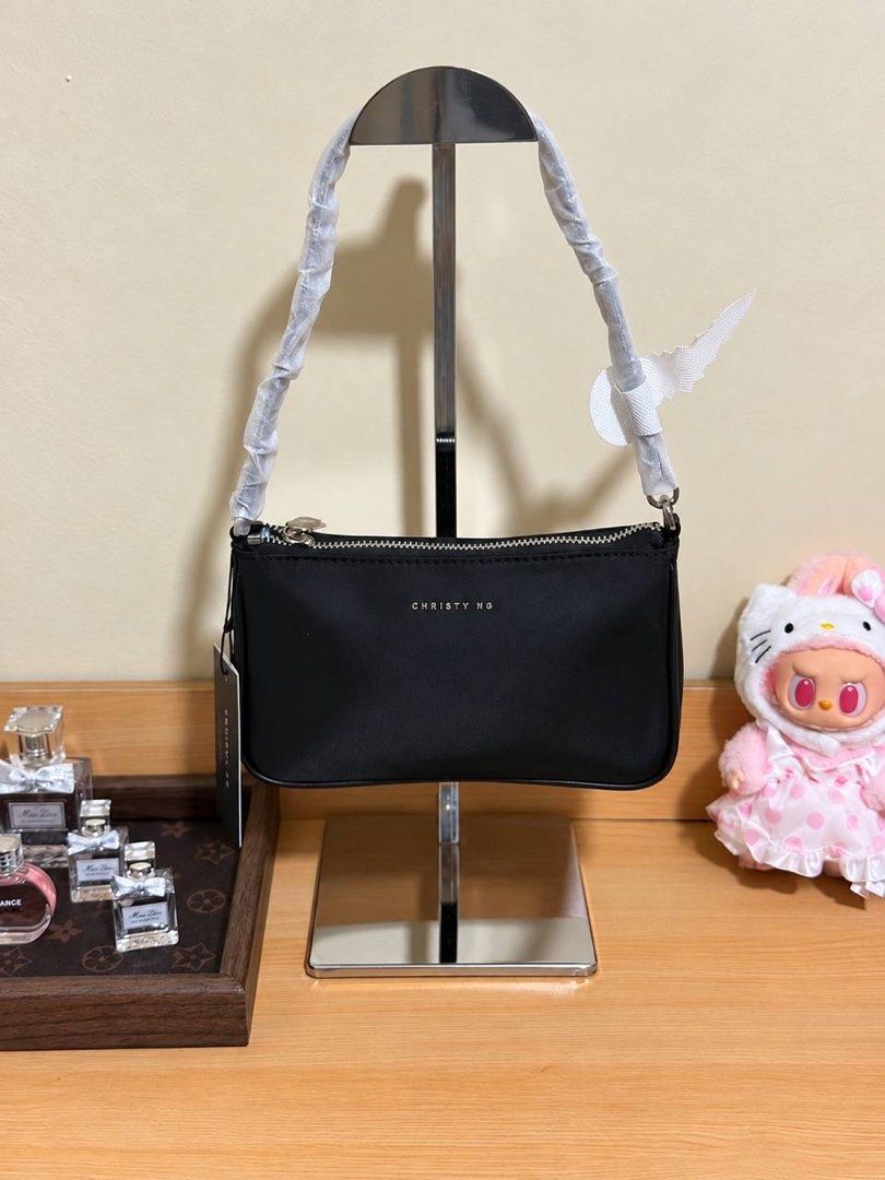 Christy Ng Milo Nylon in Black (Category: Shoulder Bags) located in Makati City. Submitted by cjonlineshop.10 (Listing ID 1469748853, Image 1). Description: CHRISTY NG 🎀 💯% Brandnew 💯% Original 10x Money Back If Proven Fake😚 Complete Inclusion: Paper Bag, Dust Bag w/ Price Tag. Actual photo posted‼️.