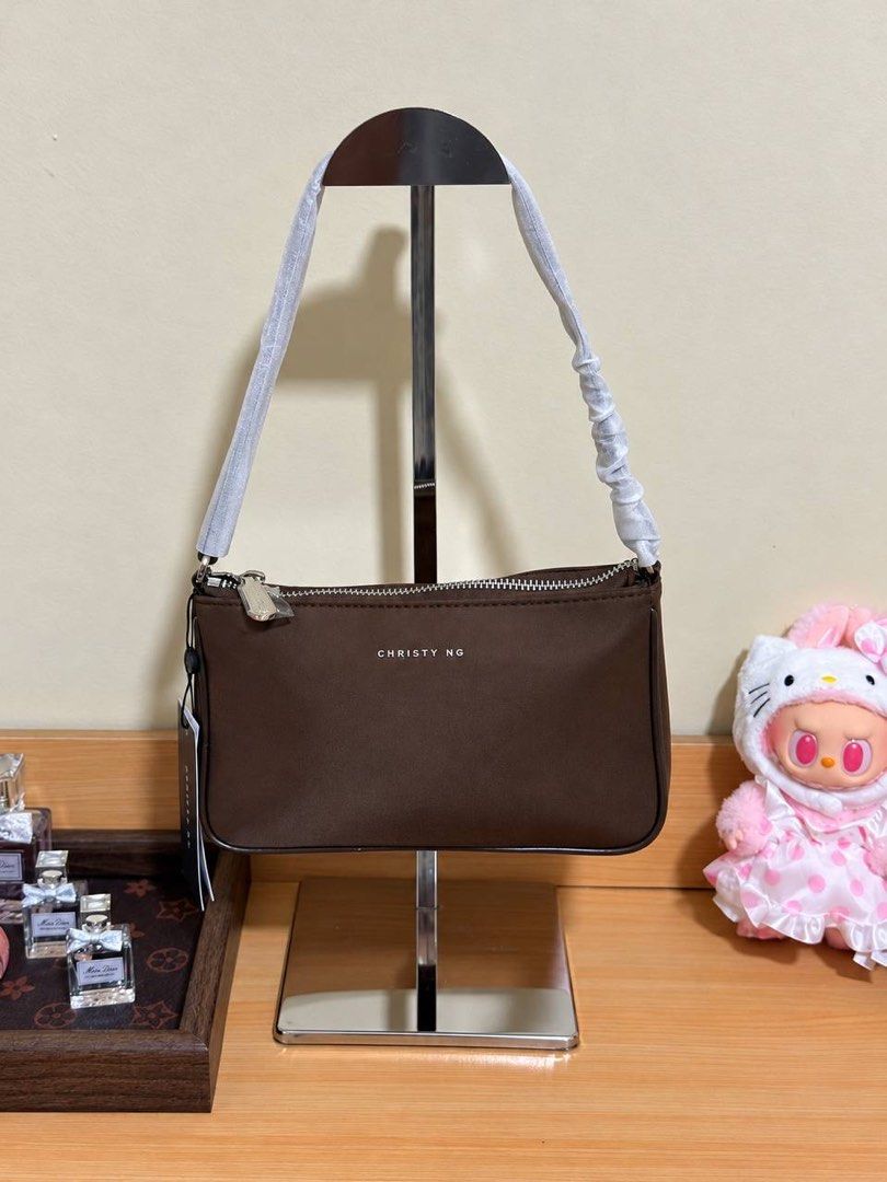 Christy Ng Milo Nylon in Espresso Brown (Category: Shoulder Bags) located in Makati City. Submitted by cjonlineshop.10 (Listing ID 1469748950, Image 1). Description: CHRISTY NG 🎀 💯% Brandnew 💯% Original 10x Money Back If Proven Fake😚 Complete Inclusion: Paper Bag, Dust Bag w/ Price Tag. Actual photo posted‼️.