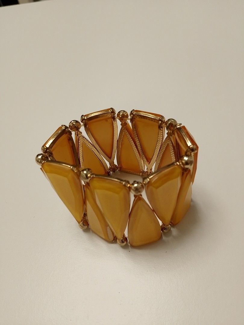 Chunky yellow and gold statement stretch bracelet (Category: Bracelets) located in Manila. Submitted by batchi1019 (Listing ID 1469583030, Image 2). Description: - Vibrant bright yellow and gold statement bracelet - Eye-catching triangular resin/acrylic stones linked with gold-tone metal beads - Convenient slip-on design with a stretchy inner band for easy wear - Adds a gorgeous pop of color to elevate any outfit - Condition: Brand new / Excellen