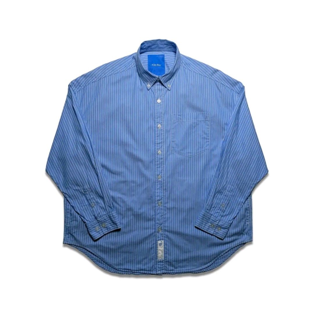 City Boy Blue Striped Button Down Shirt Oversized (Category: Tshirts & Polo Shirts ) located in Caloocan City. Submitted by garciaflor47520 (Listing ID 1469627092, Image 1). Description: - Brand/Style: City Boy striped button-down shirt - Color: Classic blue and white stripes - Fit: Relaxed, oversized fit ideal for streetwear - Details: Classic collar, front button closure, single chest pocket, long sleeves - Condition: Clean with no obvious flaw