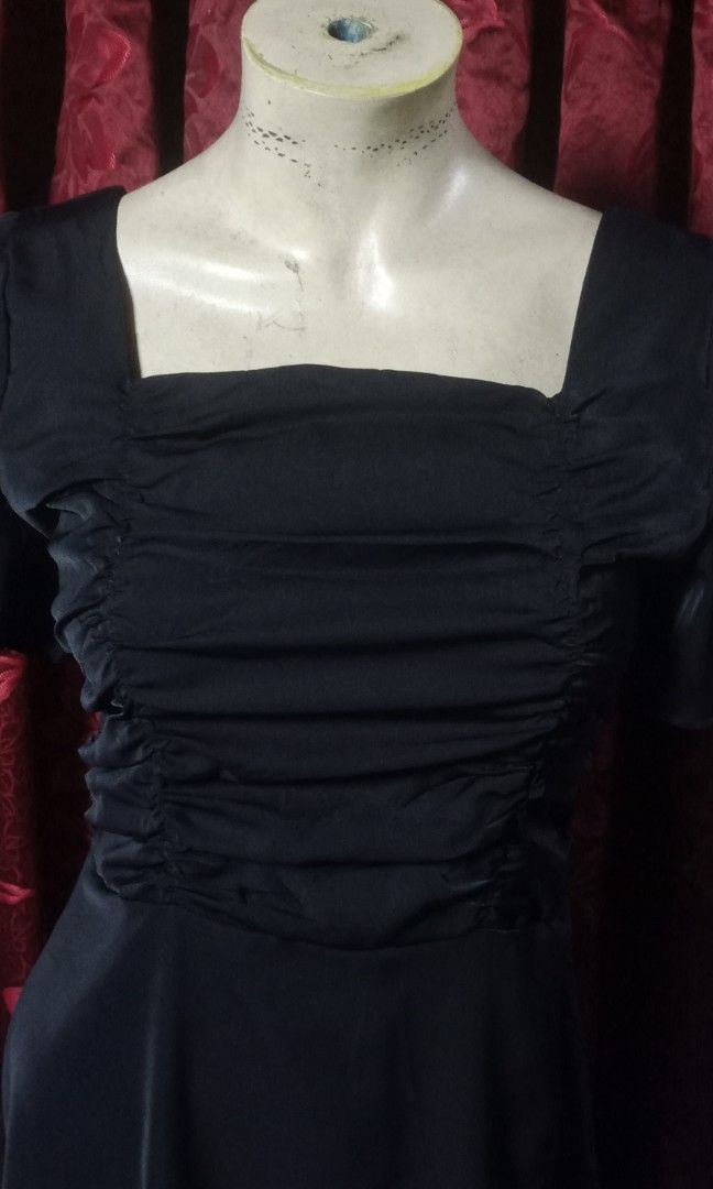 Classic black maxi dress (Category: Dresses) located in Manila. Submitted by wheneity67thifted (Listing ID 1469616610, Image 3). Description: The image shows a classic black midi or knee-length dress featuring a square neckline, ruched front bust detailing, and short flutter or puff sleeves..