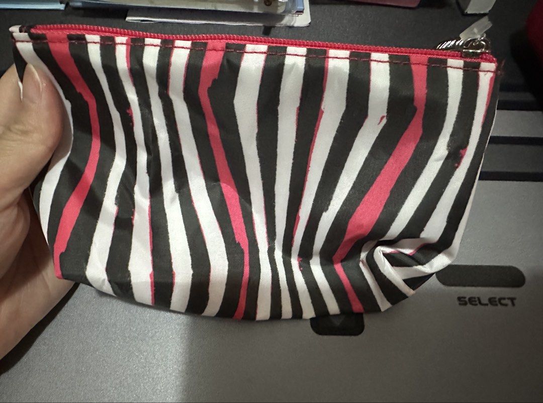 Clinique Striped Cosmetic Pouch Makeup Bag (Category: Purses & Pouches) located in Manila. Submitted by lunalux09 (Listing ID 1469717757, Image 1). Description: - 100% Authentic Clinique cosmetic pouch - Stylish black, white, and pink vertical stripe exterior - Vibrant pink interior lining with a roomy space for makeup and essentials - Secure pink zipper closure featuring a custom branded metal pull - Brand new with attached Clinique product tag 