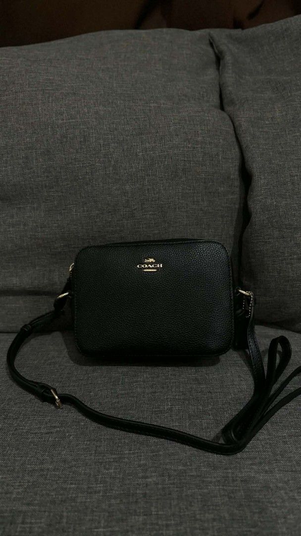 Coach Black Leather Camera Crossbody Bag (Category: Cross-body Bags) located in Cavite. Submitted by loriojenni09117 (Listing ID 1469714249, Image 1). Description: - Brand: Coach - Material: Premium black pebble leather - Hardware: Elegant gold-tone - Closure: Secure zip top - Strap: Adjustable shoulder strap included - Interior: Clean lining with a convenient slip pocket - Details: Serial tag reads L1947-7734 | Made in Vietnam - Style: Classic e