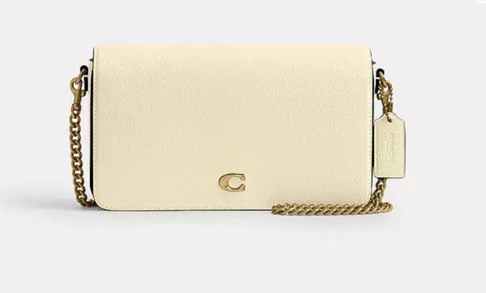 Coach Chain Crossbody Bag Off-White (Category: Luxury Bags & Wallets) located in Pasay City. Submitted by jan_ann (Listing ID 1469638080, Image 1). Description: - Authentic Coach crossbody bag - Elegant off-white leather with gold-tone chain strap and hardware - Signature small metal C logo on front flap - Includes matching hanging leather tag - Structured rectangular shape with clean stitching - Compact size, perfect for essentials orig price 44